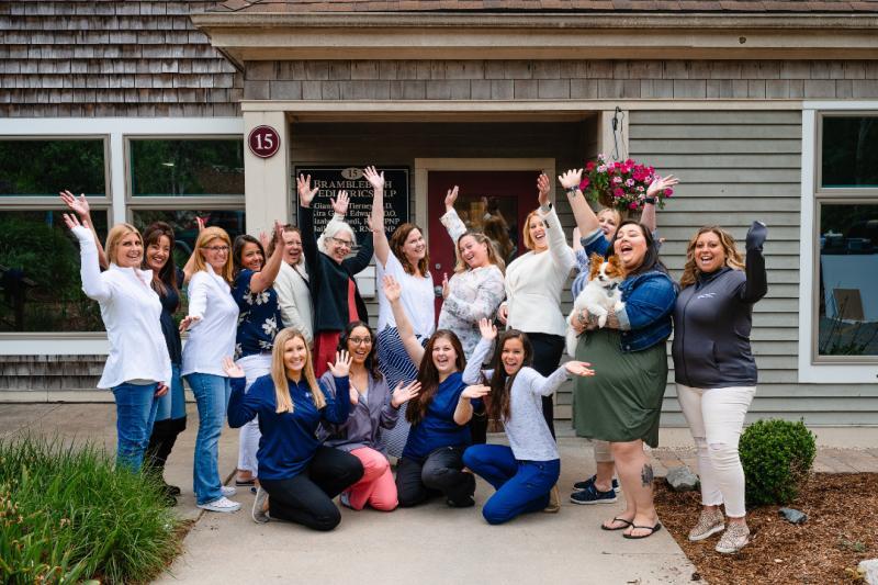 a group of medical professionals waving